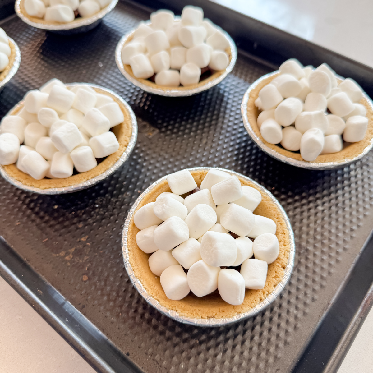 close up of mini s'more pies before baking