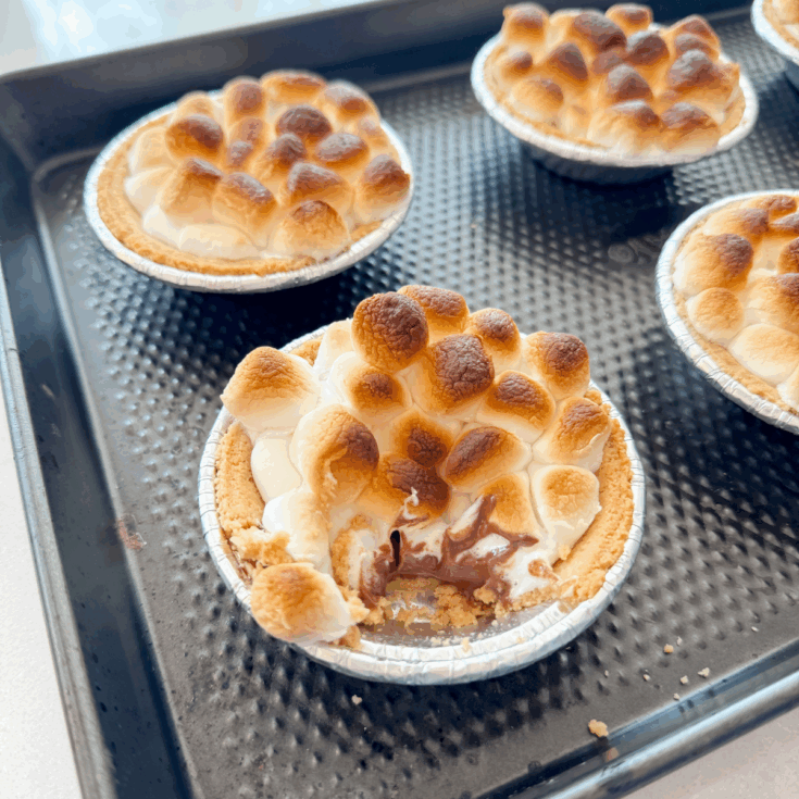 close up of mini s'more pies with a spoonful out