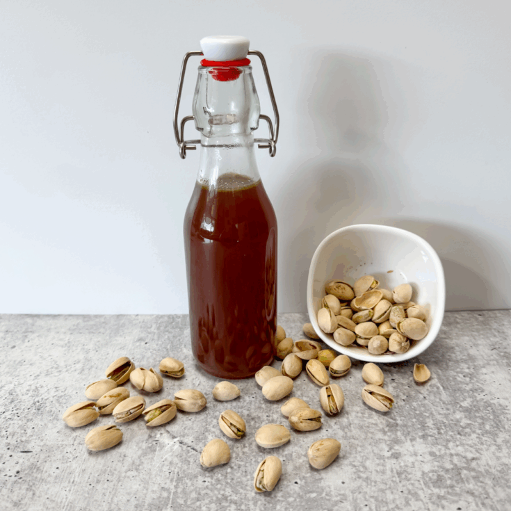pistachio syrup in a glass jar