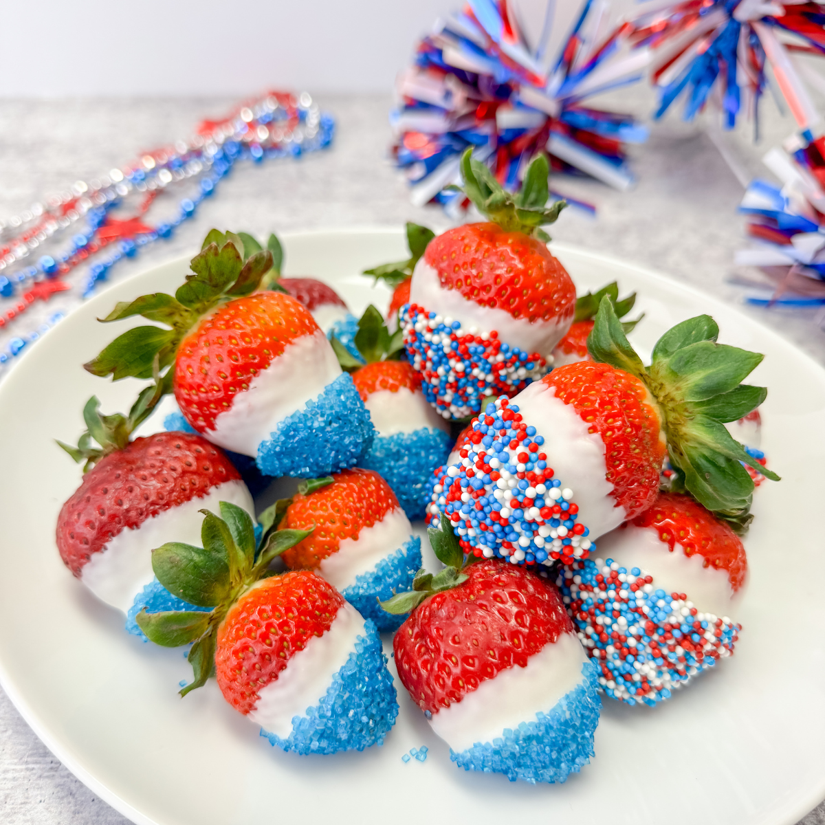 plate of 4th of july chocolate dipped strawberries