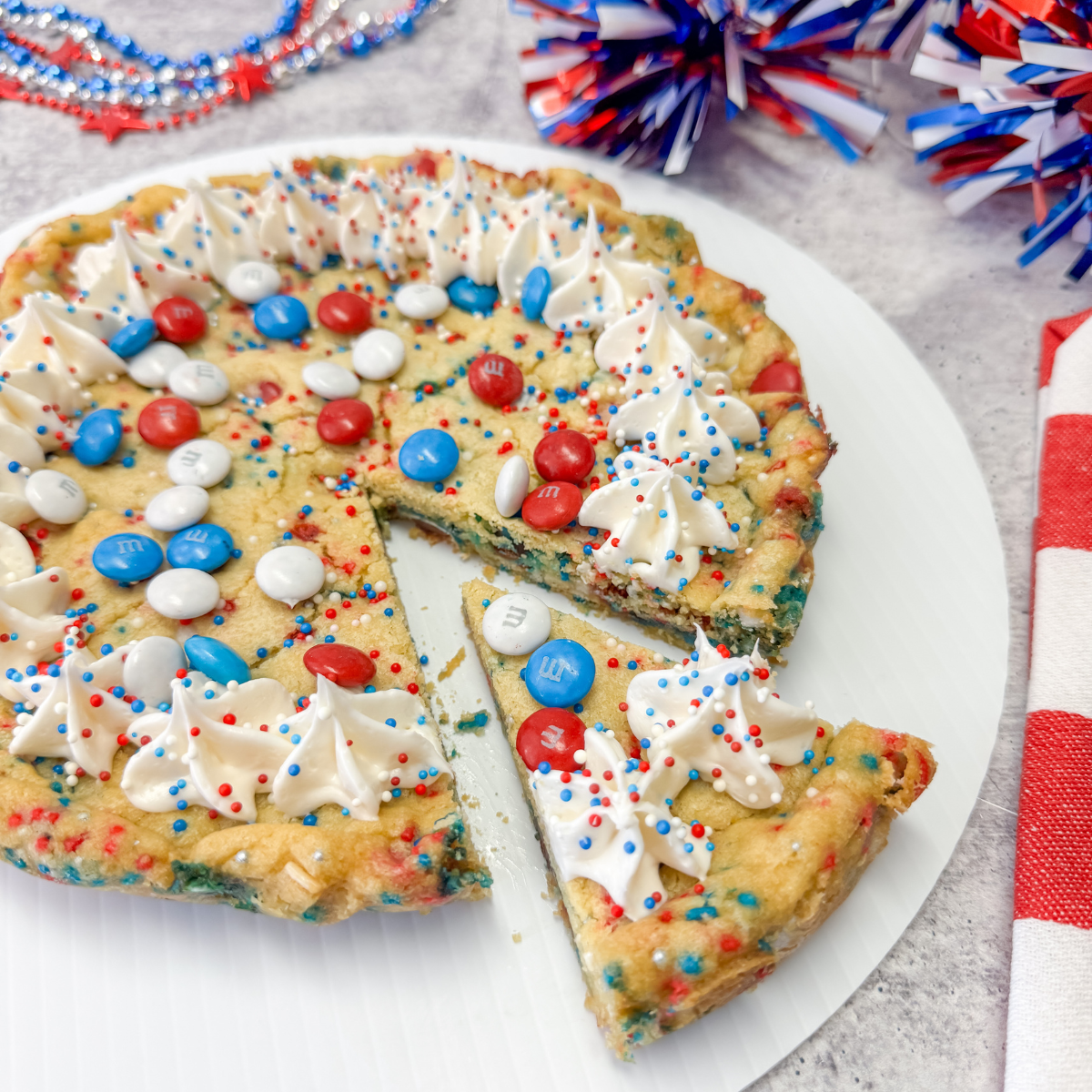 slice cut out of a 4th of july sugar cookie cake